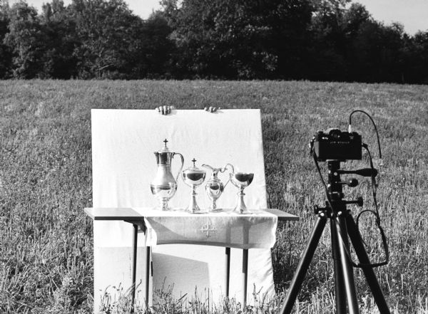 "The purpose of this setup was to photograph the Communion Ware for a church folder. Reflections were minimized in this open field.  Fingertips belong to Shirley Widmer."