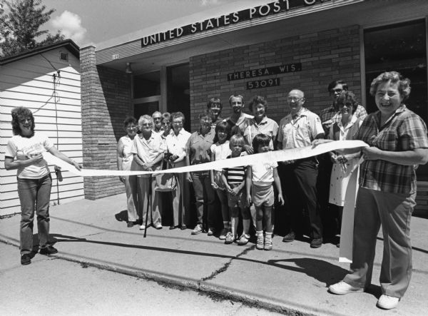 "A ribbon cutting ceremony was held when Theresa's new Post Office was officially opened."