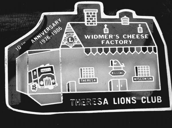 "An image of Widmer's Cheese Factory adorned a Theresa Lions Club Pin."