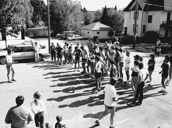 "Chuck Berhard gives instructions to runners at the American Legion Run."
