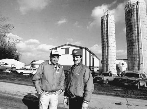 "Gordon Berg, left, Brownsville area farmer, posed with his hired helper at his state-of-the-art farm."