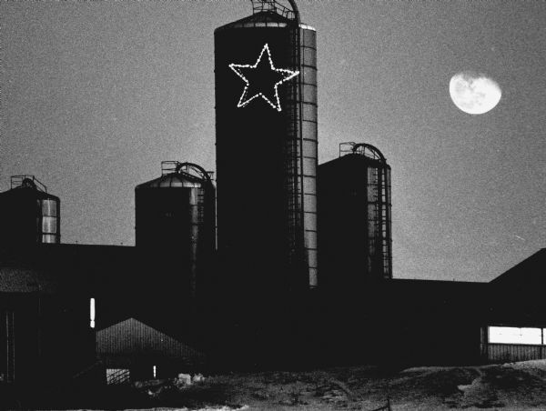 "Under early January moon, a large Christmas star placed on a silo on the Gerald Adelmeyer farm was visible for miles. The farm is on West Bend Road."