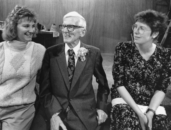 "Tammy Diedrich and Kay Widmer-Hren congratulate Ralph Widmer on his 75th birthday."