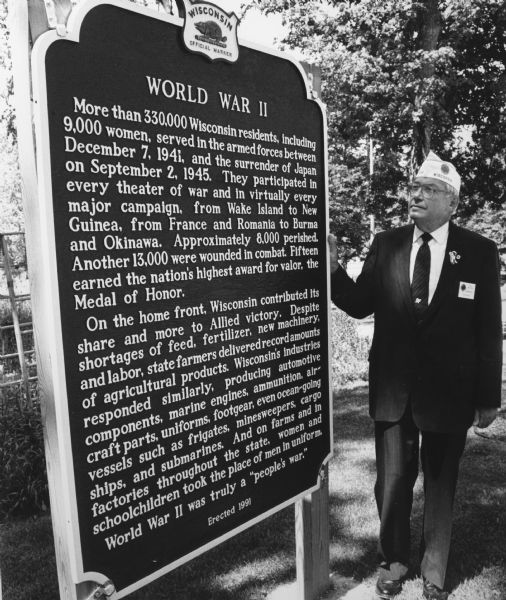 "When this marker was dedicated, Highway 41 as designated the World War II Veteran's Memorial Highway."