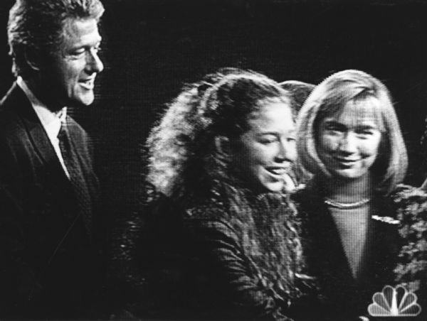 "Bill Clinton, with wife Hillary, and daughter, Chelsea, relax at the conclusion of the debates."