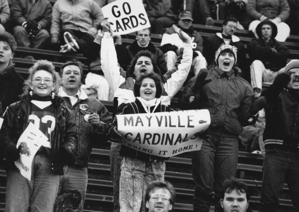 "For the second year in a row the Mayville High School football team carried unbeaten records into the championship finals at Camp Randall Stadium. Both years they were defeated in their quest for the championship trophy. Final score - Baldwin-Woodville 11, Mayville 7."