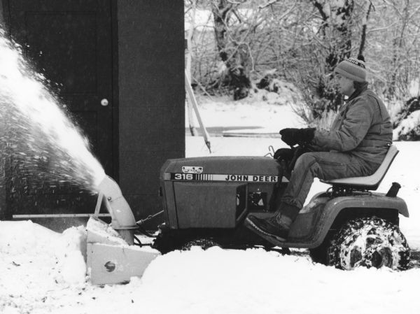 "Jody Steger snowblows at the village lift station on Wisconsin Street."