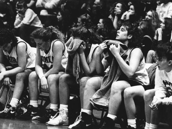 "After losing to Cuba City, the Lomira Lions sit dejectedly on the bench. Members from left are Becky Schberl, Jodi Collien, Gina Tagliapietra, Julie Benter, and Becky Wondra."