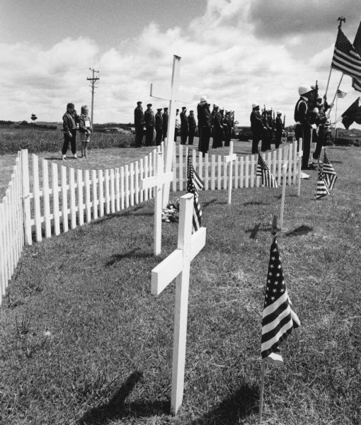 "American Legion members honor deceased comrades on Memorial Day."