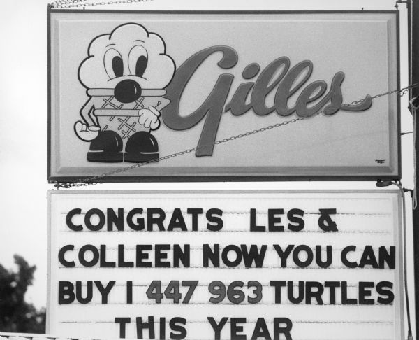 Sign congratulating the lottery winners at Gilles Frozen Custard Drive-in.