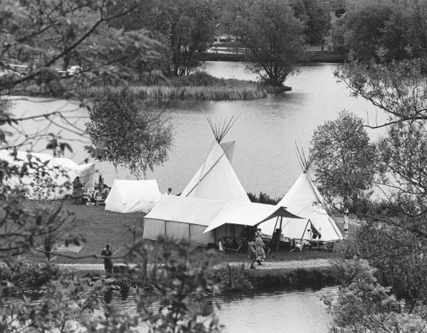 "Pioneer reenactors set up their tents on the Rock River in Mayville."