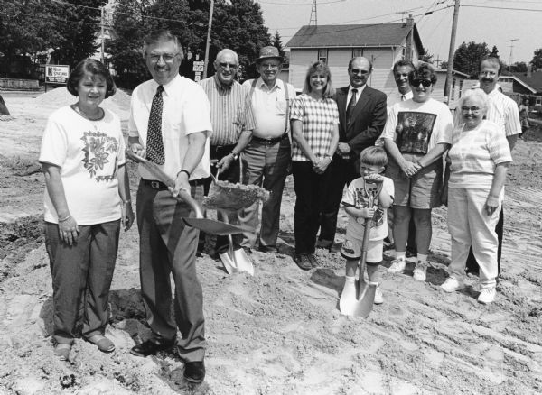 "John Lauer with his wife, Patti, participated in groundbreaking ceremonies for a proposed Cwik Mart at the corner of Milwaukee & Part Streets."