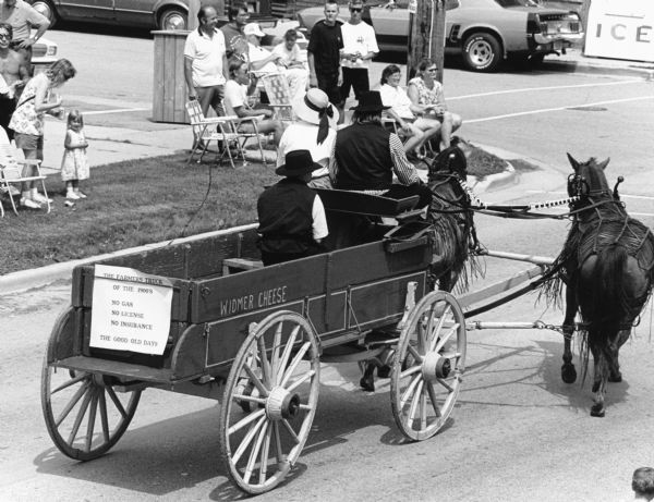 "Parade in Theresa, corner of Milwaukee and Henni Street." Image features the Widmer cheese wagon.