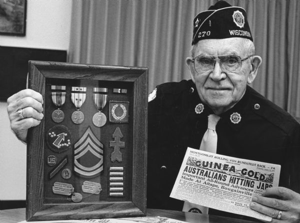 "Les Beck displayed World War II memorabilia on Veteran's Day, Nov. 11. Les served 39 months overseas with the famed 32nd Red Arrow Division."