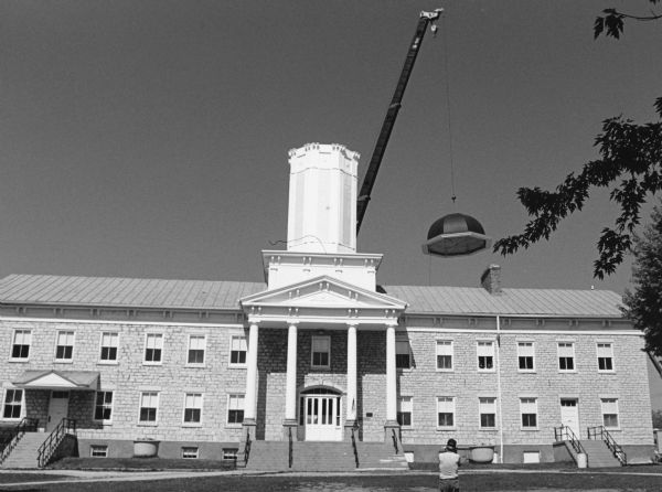 "A cupola is added to the Historic White Limestone School in Mayville."
