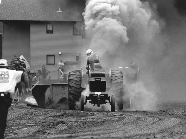 "The Theresa Lions Club Annual Tractor Pull at Firemen's Park.  This contestant is from New Hamption, IA."