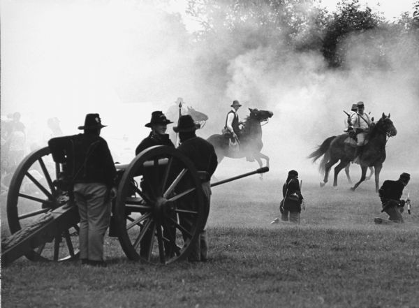 "Pioneer Days is celebrated at Firemen's Park. Civil War reenactors, in period garb, put on a show of battlefield conditions."