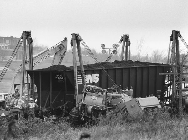 "Heavy-duty moving equipment from Michels Pipeline of Brownsville helped to move derailed cars back onto the tracks. Within 27 hours, all cars were righted and the track was repaired."