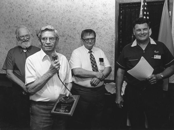 "The 'Theresa Lions Club Citizen of the Year' is Ralph 'Buddy' Ruecker. Presenting the award are, from left, Willard Bogenschneider, Neil Coulter, and Carl Benter."