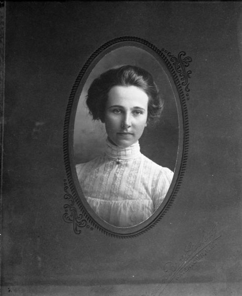 Unidentified copy of quarter-length oval studio portrait of a young woman taken by Alexander Krueger.