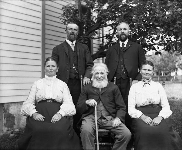 Portrait of William Krueger with four of his children. Sitting from left to right are: Bertha Krueger Goetsch, William Krueger, and Minnie Krueger Krause. Standing behind them from left to right are Albert and Henry Krueger.