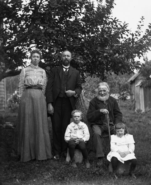 Portrait of the Krueger family. From left to right: Mae, Professor Henry, Everett, William, and Rexford Krueger.