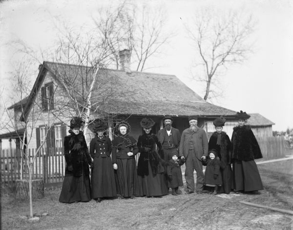 View of the Krueger family in front of the old house, taken at the time of Grandfather Goetsch's funeral.