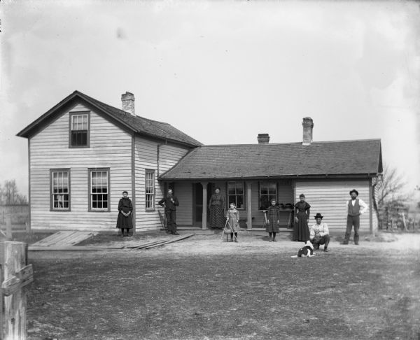The family standing outside the Herman Backhaus homestead.