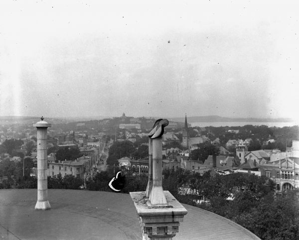 Elevated view from the Wisconsin State Capitol roof of the city of Madison. State Street leads toward the Wisconsin State Historical Society and Bascom Hall. Lake Mendota is on the right.