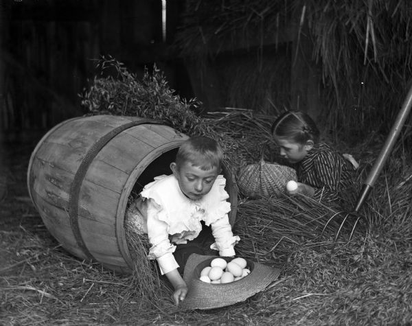 Edgar and Jennie Krueger playfully hunting for eggs.
