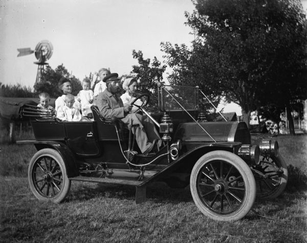 The Albert Goetsch family sitting in their Studebaker EMF on the Krueger farm.