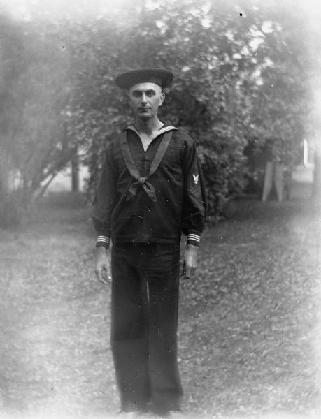 Outdoor portrait of Edgar Krueger posing in a US Navy uniform on the Krueger farm.