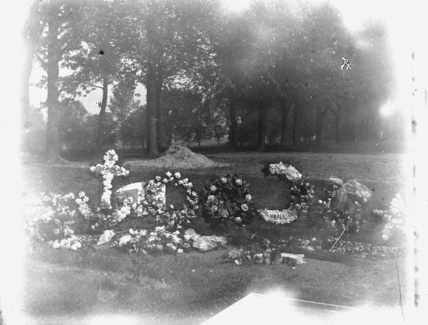 Funeral floral arrangement for August Krueger at Oak Hill Cemetery.