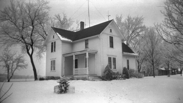 View from yard of the home of Florentina and Alexander Krueger during winter. The ground is covered in snow.