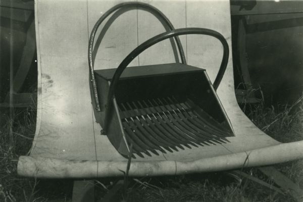 A cranberry rake used for the manual harvest of cranberries.
