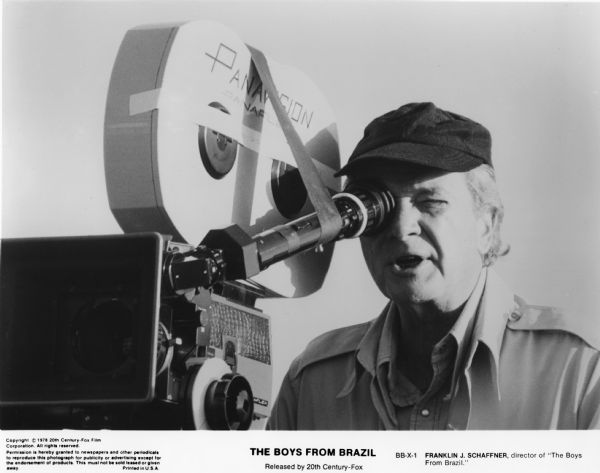 Franklin J. Schnaffner, director of "The Boys from Brazil" (Fox, 1978). Schnaffner is looking through the viewfinder of a Panaflex camera.

