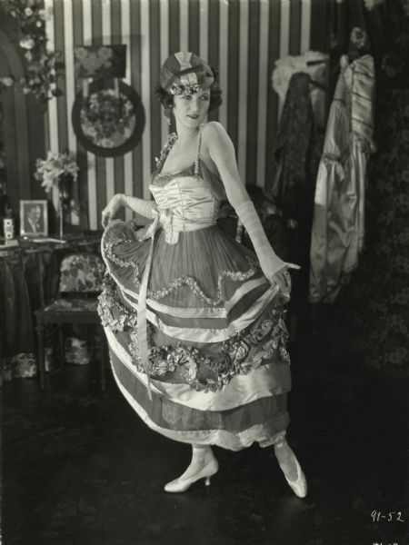 Irene Castle in a complicated satin and tulle costume in her role as the cabaret dancer Palma May in the silent film "French Heels" (Holtre 1922).