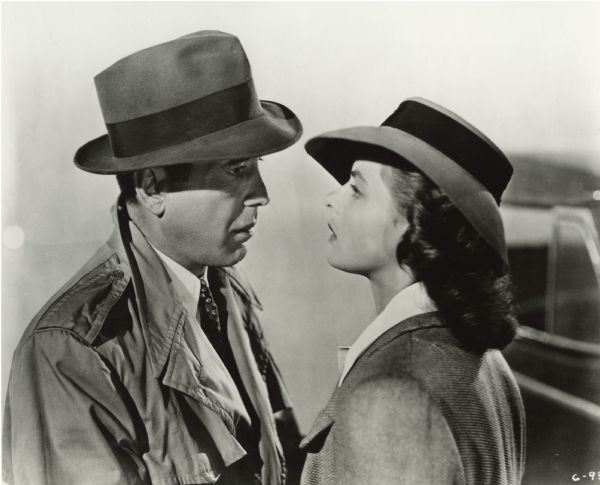 Humphrey Bogart (playing Rick Blaine) faces Ingrid Bergman (as Ilsa Lund) in a scene still from "Casablanca" (Warner 1942). This tender moment is from the famous airfield scene at the end of the film.