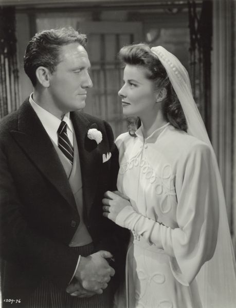 Spencer Tracy and Katharine Hepburn are dressed in wedding clothes in this publicity still for "Woman of the Year" (MGM 1942).
