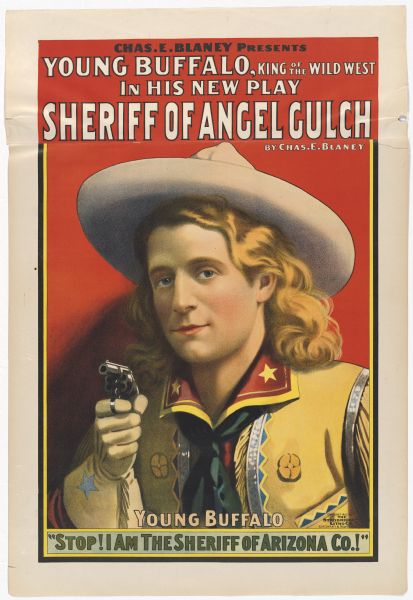 Color lithograph poster. The top caption reads: "Chas. E. Blaney presents Young Buffalo, King of the Wild West in his new play," and beneath this in larger lettering is "Sheriff of Angel Gulch," with Blaney's name repeated again below it. The image is a close-up of Young Buffalo pointing a revolver toward the viewer. The bottom caption reads: "Young Buffalo" and below it is the line from the play "Stop! I am sheriff of Arizona Co.!"