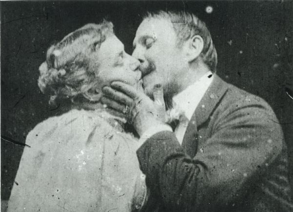 A frame enlargement from Thomas Edison's 1896 silent film "The Kiss" featuring May Irwin and John C. Rice reprising the controversial final scene of the play "The Widow Jones" in which they had starred in 1895.