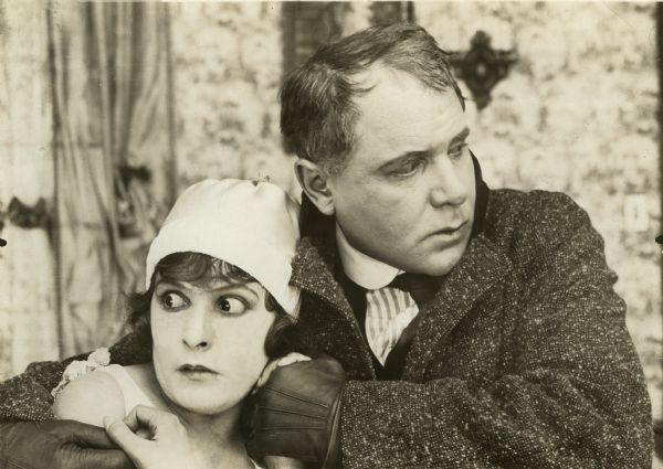 Grace Remington (played by Norma Talmadge) and her husband John Remington (Ralph Lewis)  are in a state of acute alarm in this scene still from the silent film "Going Straight."