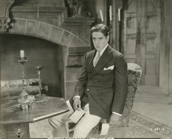 Captain Dieppe (played by Robert Warwick) sits gloomily on the arm of a chair in the  Northern Italian castle of Count Fieramondi. In his hand is a distressing note.