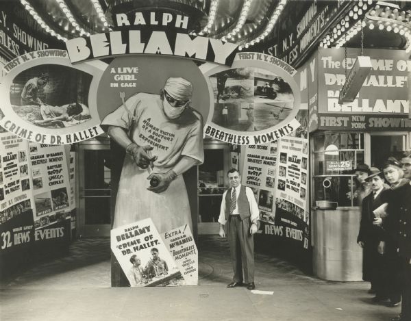Extensive promotional exhibit in front of an unidentified New York theater for the 1938 Universal film "The Crime of Doctor Hallet" starring Ralph Bellamy. Also on the bill was "Breathless Moments" with Graham McNamee, apparently a short film of sports highlights.