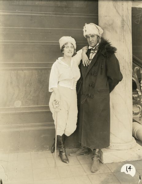 Grace Cunard (as Kitty Gray, holding a sword), and Francis Ford (as Count Frederick) pose in a publicity still for Episode 14 "On the Battle Field" of the Universal serial "The Broken Coin."