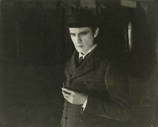 Half-length promotional still of John Barrymore playing Sherlock Holmes in a night scene from "Sherlock Holmes' (Goldwyn 1922).