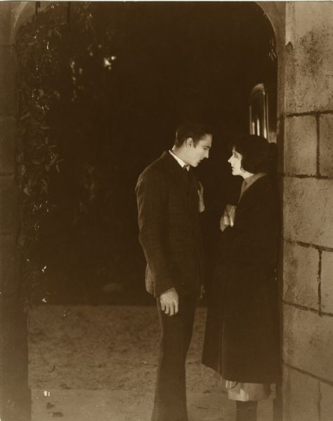Sherlock Holmes (played by John Barrymore) and Alice Faulkner (Carol Dempster) in a night-time scene still for the 1922 silent film version of "Sherlock Holmes."