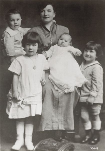 Harriet Curran Kelly and her four children in a studio portrait from about 1914. From left to right the children are Eugene, Harriet, Louise, and James. With Frederic, the last Kelly child to be born, the Five Kellys performed in vaudeville. Eugene became internationally famous as the singer and dancer Gene Kelly.