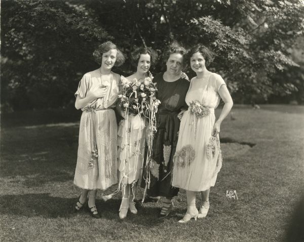 Original caption: "Constance Talmadge, Natalie Talmadge, Mrs. Talmadge, and Norma Talmadge at the Talmadge-Keaton wedding at Norma Talmadge's estate at Bayside, Long Island, on May 31st, 1921."