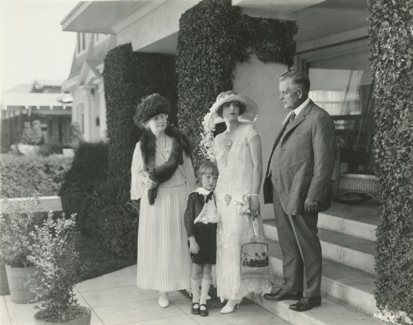 Silent film star Claire Windsor (center) with her small son David Willis Bowes Jr. in a Fauntleroy suit, flanked by her mother, Rosella Fearing Cronk, and her father, George Edwin Cronk.